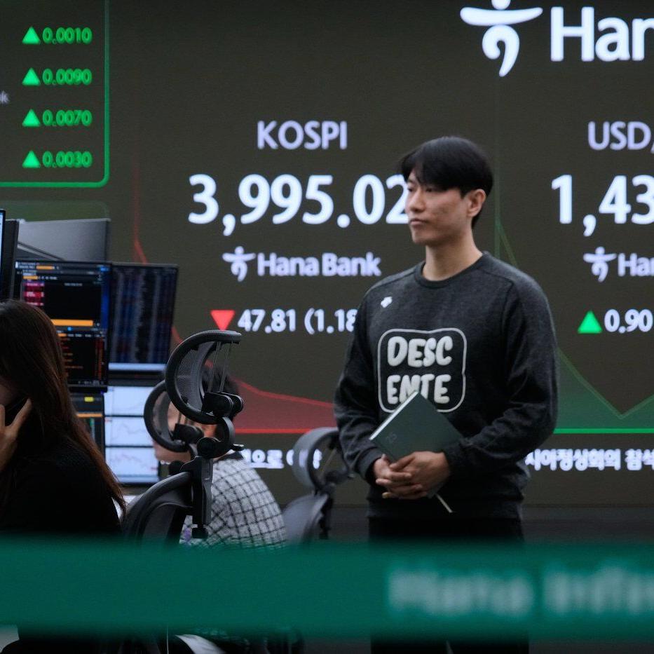 Asian shares are mixed as region watches for outcome from Trump's visits